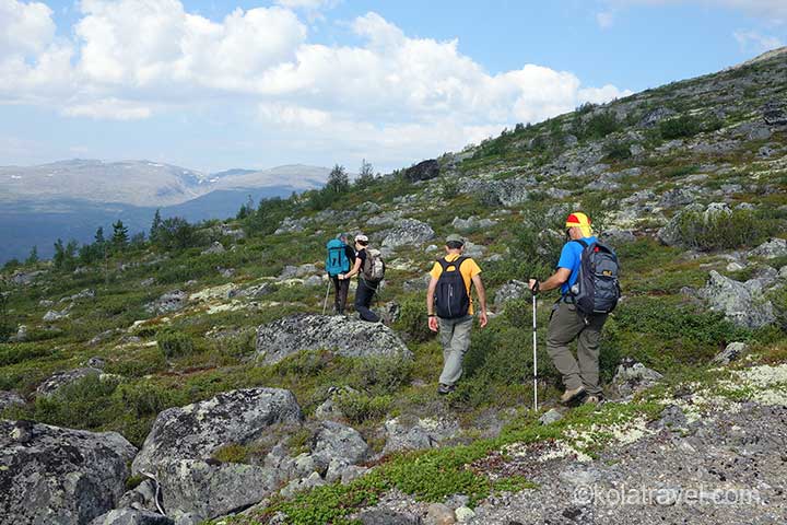 Backpack hiking tour in Monche Mountains on Kola Peninsula. Hike in virgin forests and mountains with beautiful waterfalls